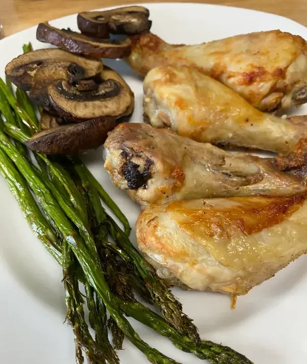 Chicken with green asparagus and mushrooms. in Air Fryer