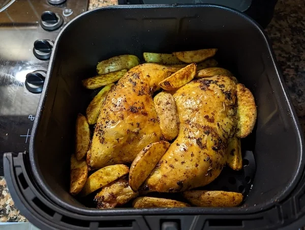 Air Fryer Roast Chicken with Potatoes
